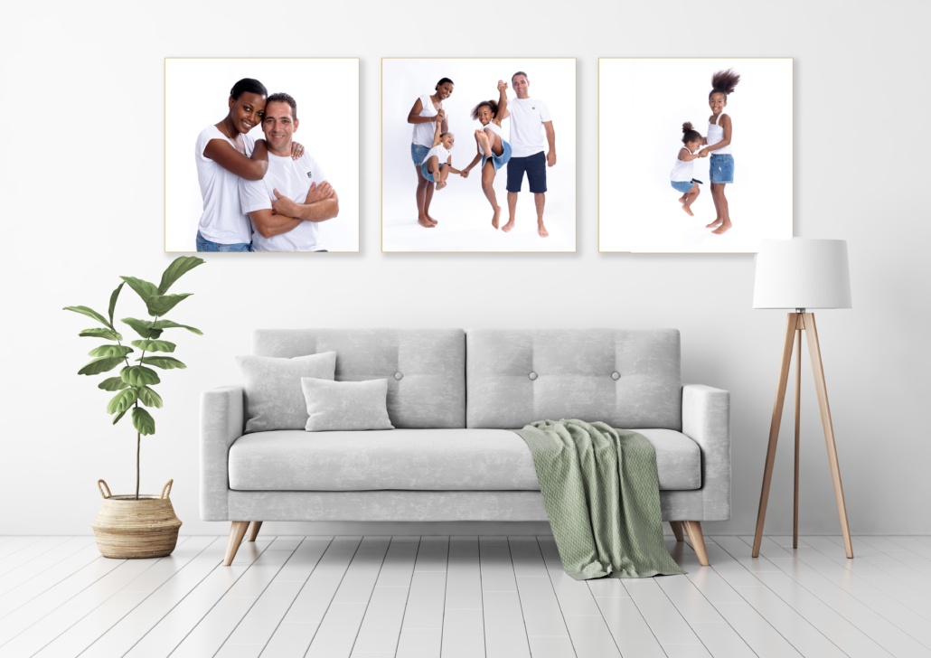 Living room interior with gray velvet sofa, pillows, green plaid, lamp and fiddle leaf tree in wicker basket on white wall background. 3D rendering.